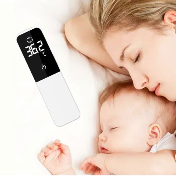 Mother and baby lying down and sleeping next to the Nouvique Australia digital thermometer.